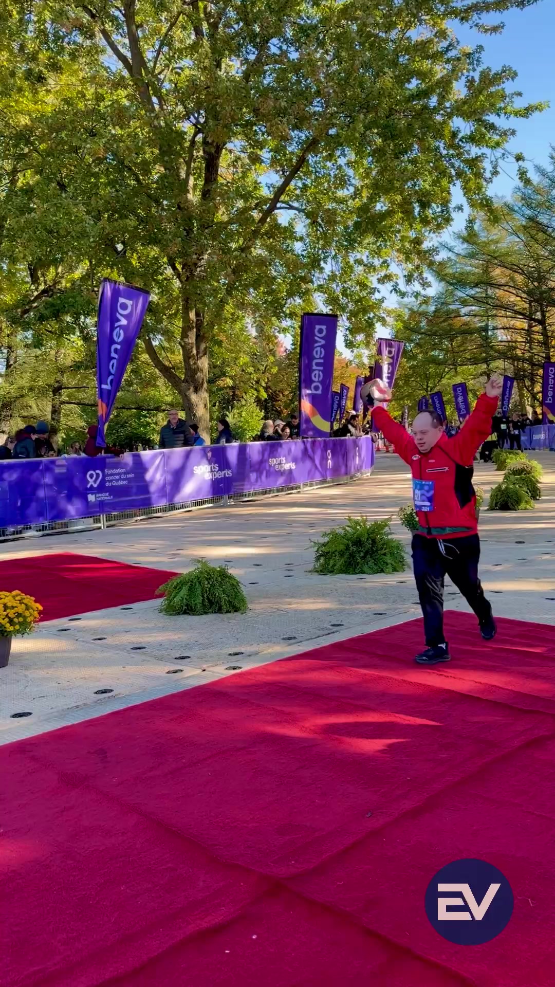A runner celebrating at the Montréal marathon finish line
